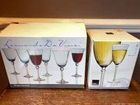 Two original boxes showing branding and capacity of the stemware sets