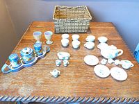 Full lot displayed on table showing tea set, condiment set and basket