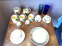 Full set on tabletop showing all ceramic and glass items