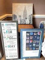 Group shot of all three art pieces leaning together