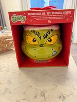 Front view showing Grinch cookie jar inside gift box
