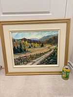 Full view of framed painting with pop can for scale