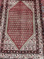 Full view of rug displaying overall design and borders
