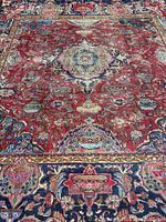 Full view of rug showing overall pattern and wear