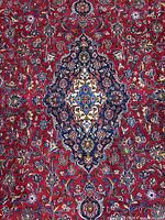 Central medallion and red field floral motifs