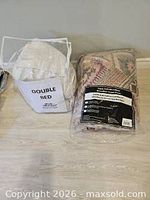 Comforter package and mattress cover in zippered bag side by side