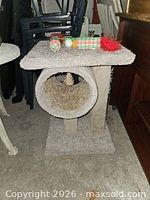 Cat tree front view with toys on top