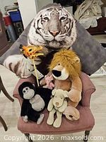 Group shot showing pillow, lion, gorilla, dog, giraffe puppet