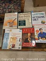 All seven books laid out on table