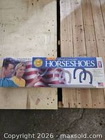 Front of unopened Contender Horseshoes box