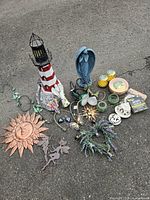 Group shot of all garden decor pieces spread on pavement