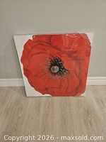 front view of red poppy canvas print in shrink wrap