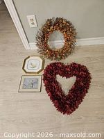 Group shot showing both wreaths and framed artworks