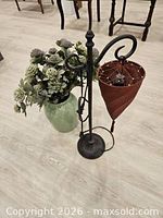 Lamp, vase, faux flowers grouped