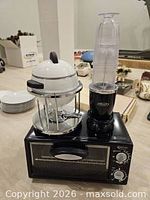 All three items grouped: toaster oven, fondue set on stand, Magic Bullet blender