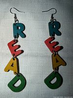 Front view of both earrings showing colour sequence and fishhook closures