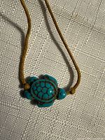 Close-up of turtle pendant front