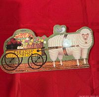 Full view of ceramic plaque showing sheep and cart