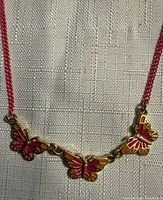 Close-up of butterfly charms showing enamel detail