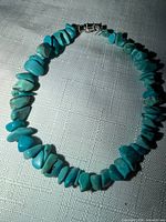 Full view of bracelet showing turquoise chip beads and clasp