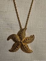 Close-up of starfish pendant showing texture and chain detail