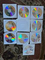 Top view of 10 DVD-R discs in white paper sleeves
