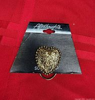 Front view of heart scarf clip on Afterthoughts card