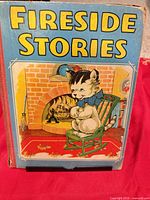 Front cover of Fireside Stories showing kitten illustration and title