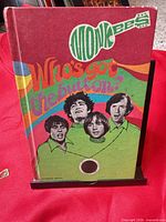 Front cover showing title, band portraits and psychedelic art