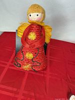 Front view of angel tree topper showing full body detail