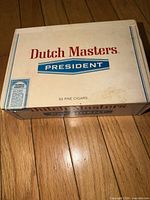 Top view of vintage Dutch Masters President cigar box showing branding and condition.