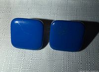 Front view of both enamel square earrings