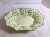 Top view of Beswick yellow floral bowl showing basketweave texture and floral painting