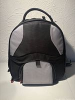 Front view of backpack showing overall design and front pocket