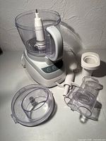 Processor base with bowl, lid, accessories laid out