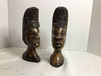 Front view of both wooden busts