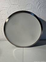 Single round brushed nickel LED ceiling light front view