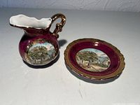 Creamer and saucer side by side, showing color, transfer and gilding
