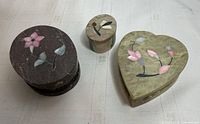 All three soapstone boxes showing shapes and inlay
