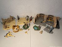 Overall view of all playset bases, vehicles and accessories spread on table