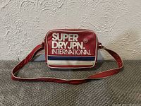 Front view showing logo, strap, overall style