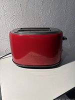 Front view of red thinkkitchen toaster