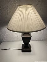 Full view showing lamp with shade illuminated