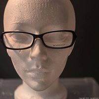 Front view of Givenchy black rectangular eyeglass frames on mannequin head
