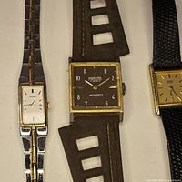 Three watches side-by-side showing overall style, bracelets and straps