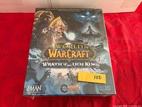 Front of shrink-wrapped box showing title, artwork and logos