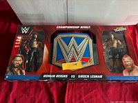 Front of Championship Rivals boxed set showing belt and both figures