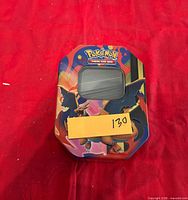 Closed Charizard-themed Pokemon tin