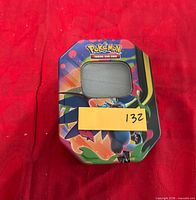 Closed Pokémon TCG tin front view