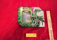 Closed Pokémon tin showing lot label